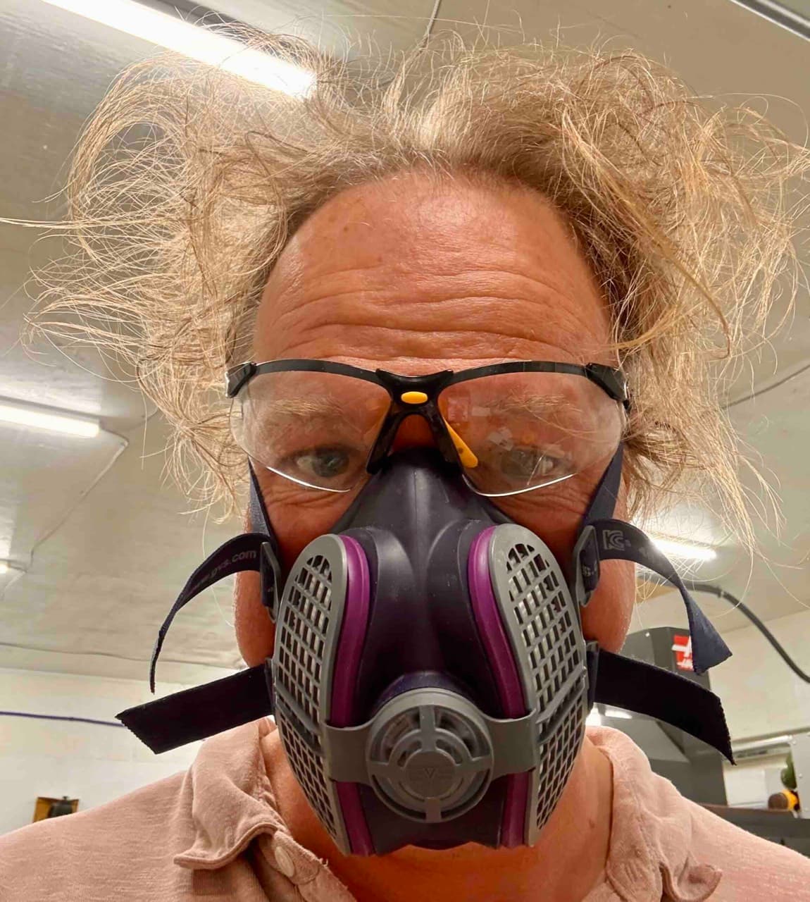 Colin Kingsbury wearing a respirator and safety glasses in the shop